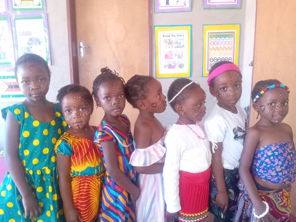Learners lined up in bright African print outfits