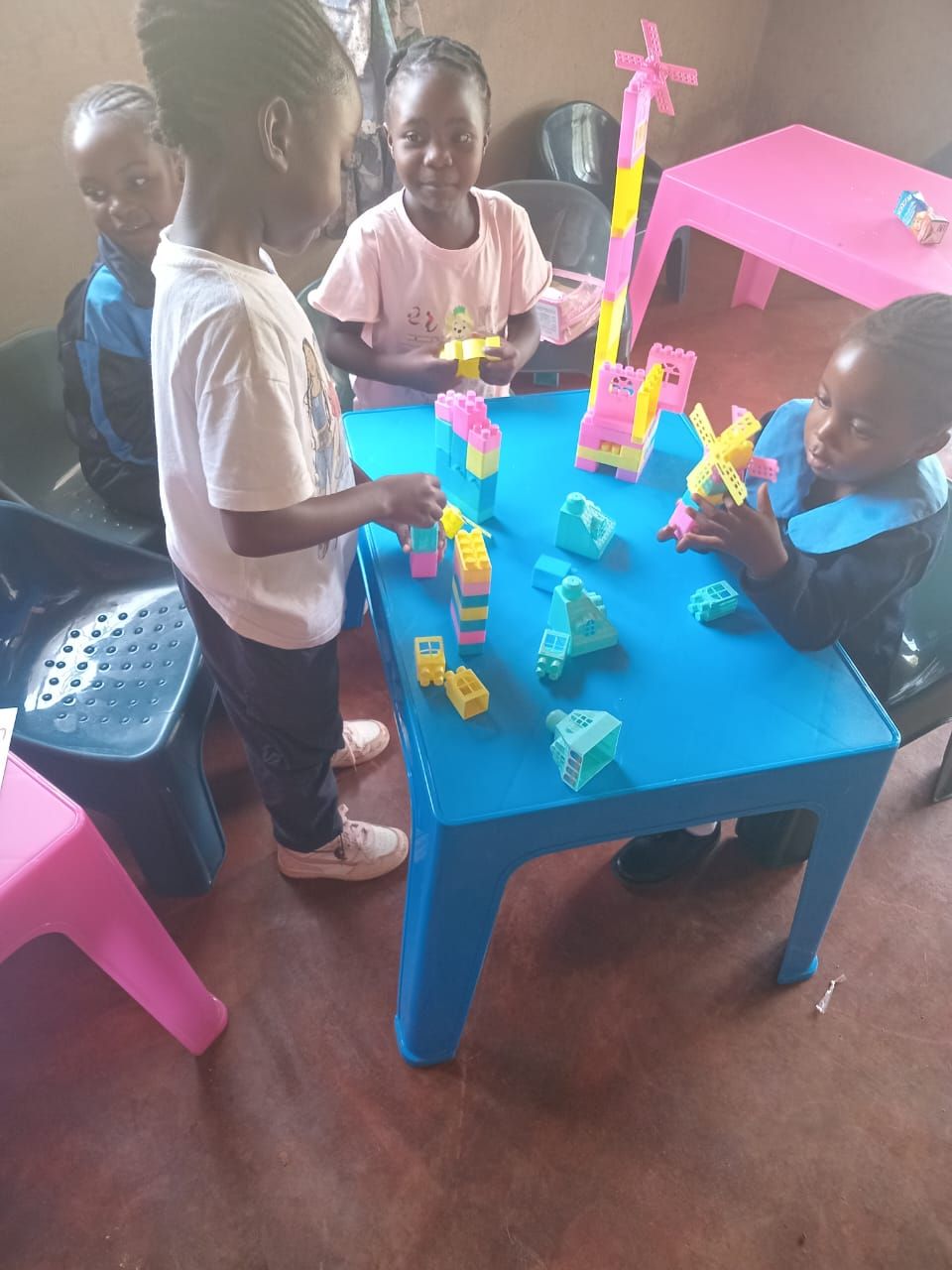 Children building towers with colourful blocks